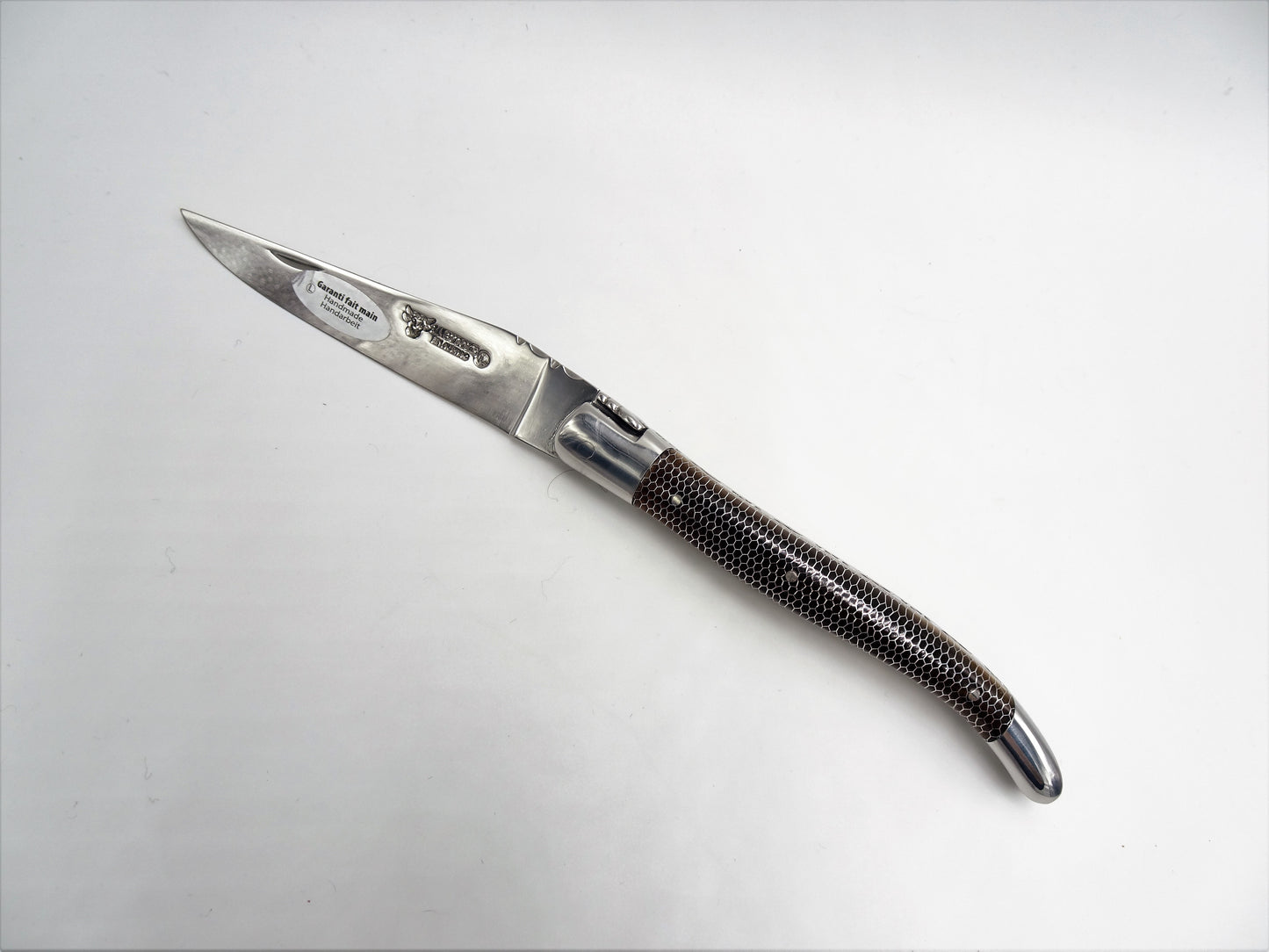 Laguiole en Aubrac coltello impugnatura a nido d'ape arancione