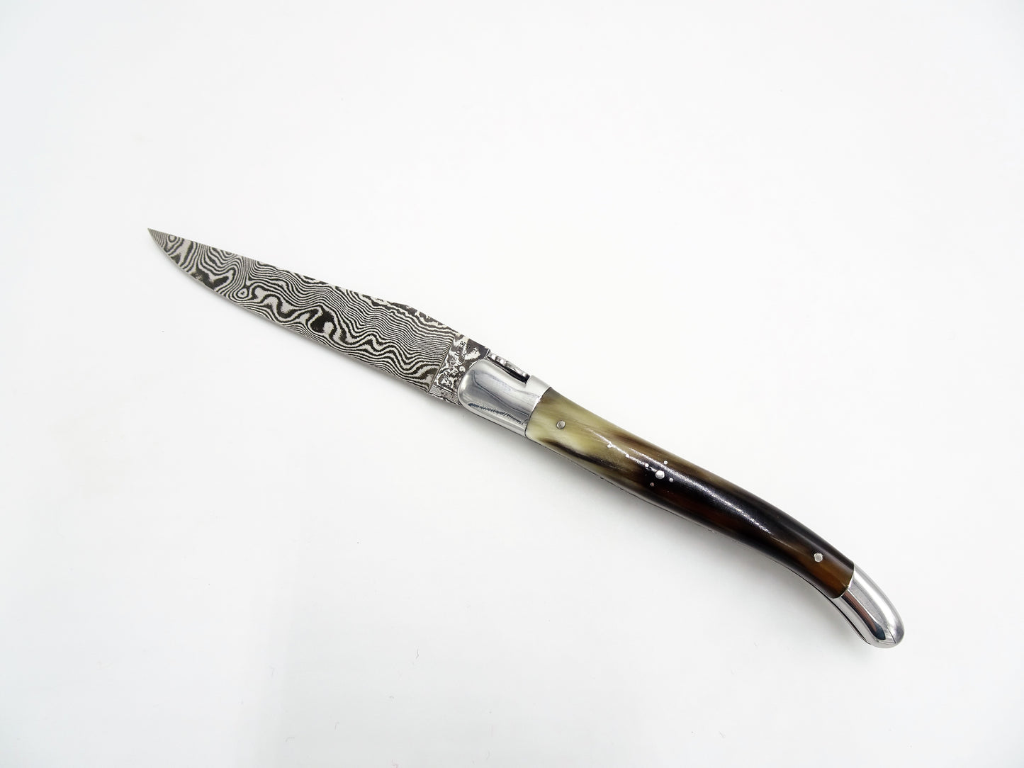 Laguiole en Aubrac coltello collezione punta di corno damascato