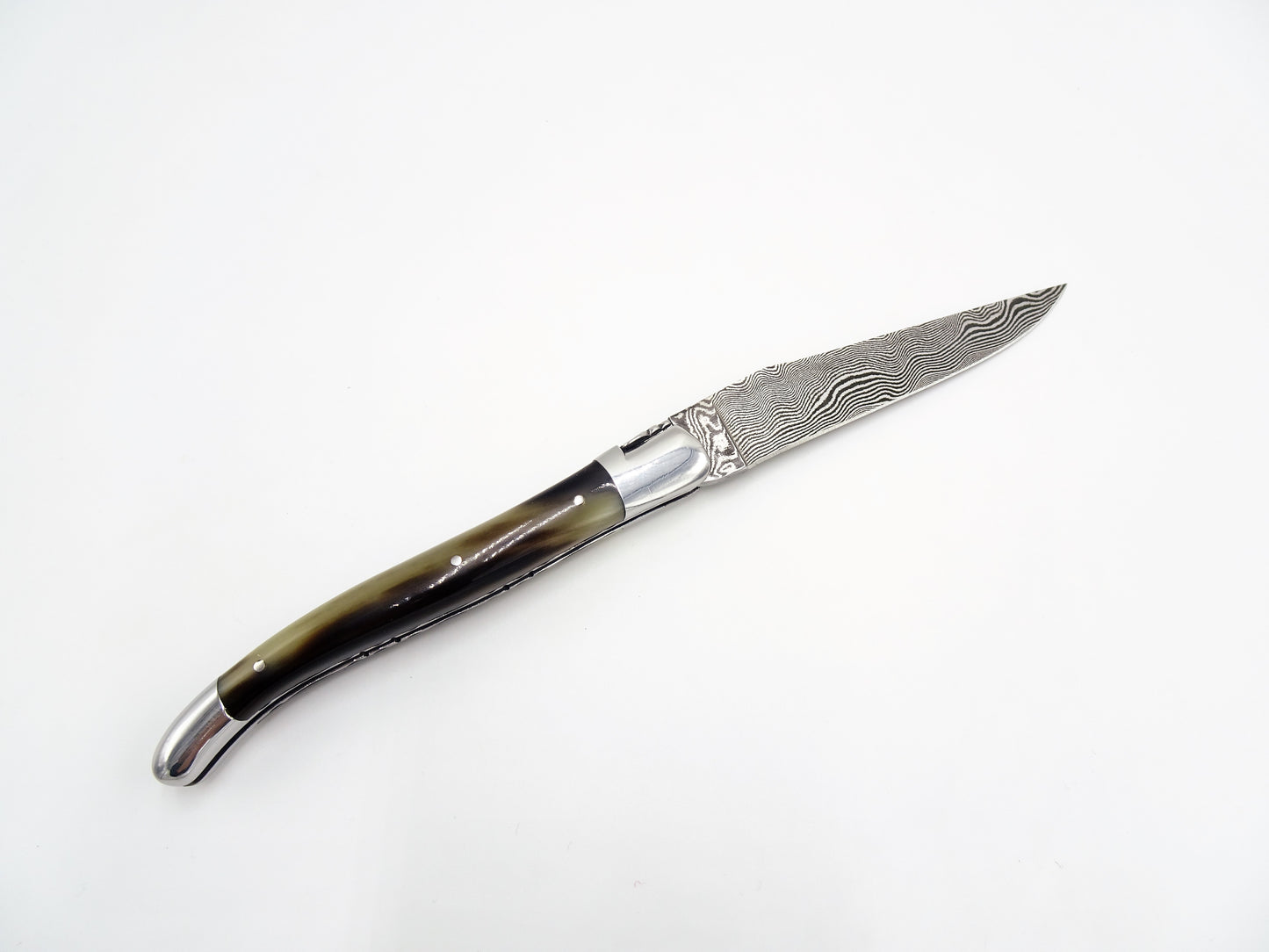 Laguiole en Aubrac coltello collezione punta di corno damascato